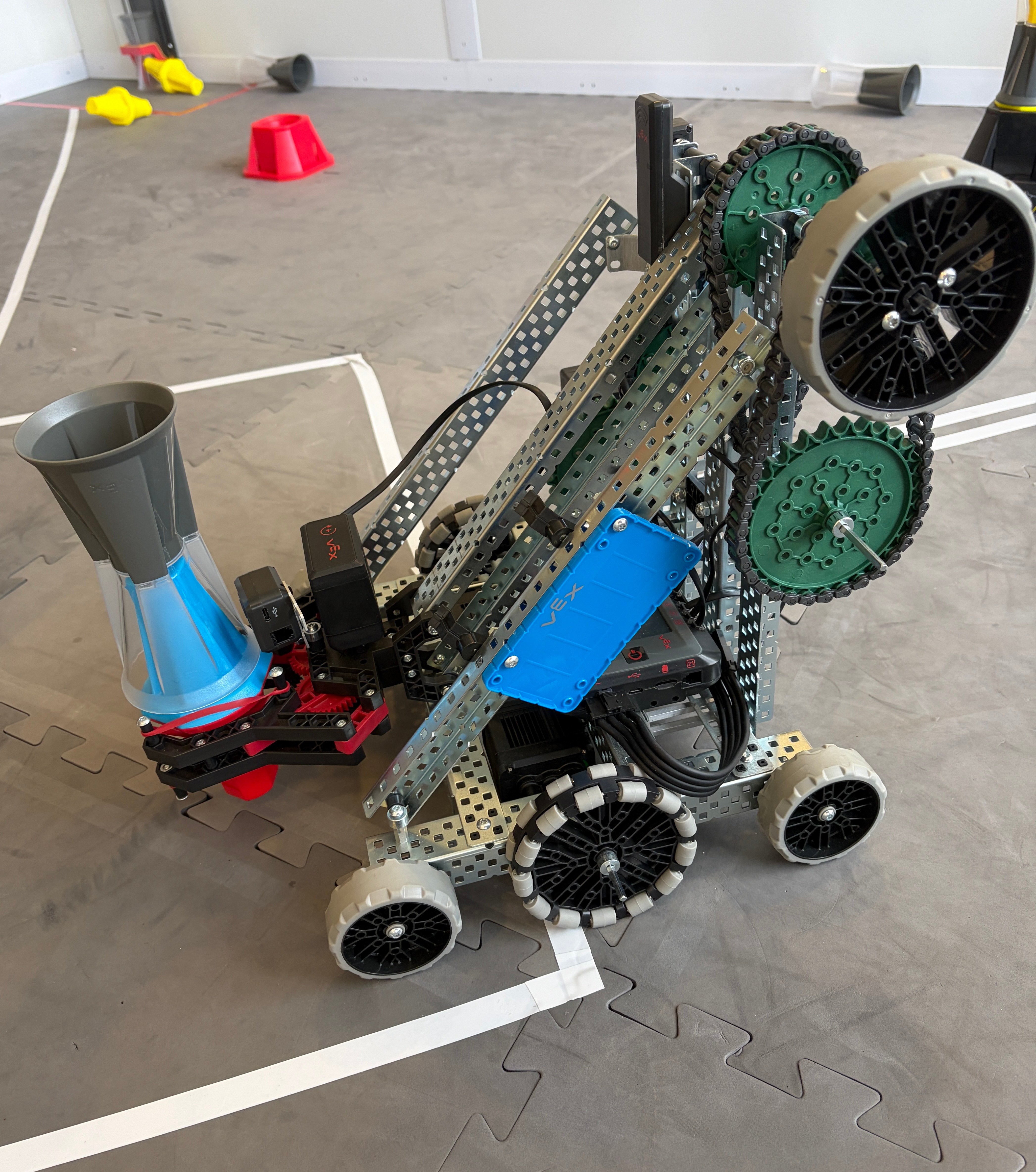 A V 5 robot with a stacked pin and cup being held by the claw