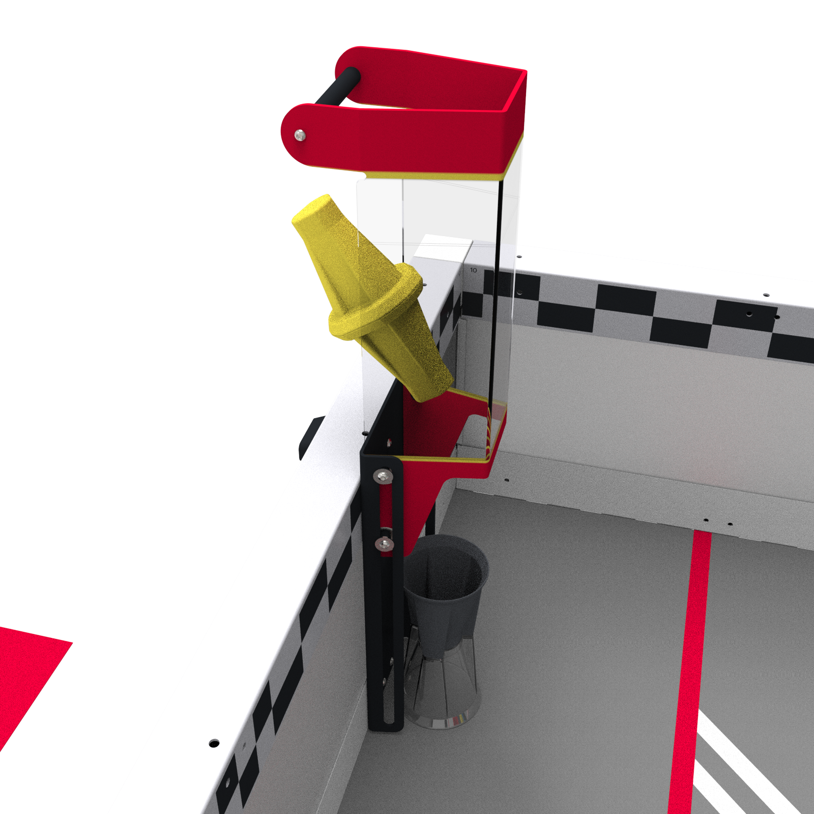 A close up view of the loader with a cup sitting on the field at the bottom of the loader and a yellow pin being inserted at an angle through the back of the loader just above the field wall.