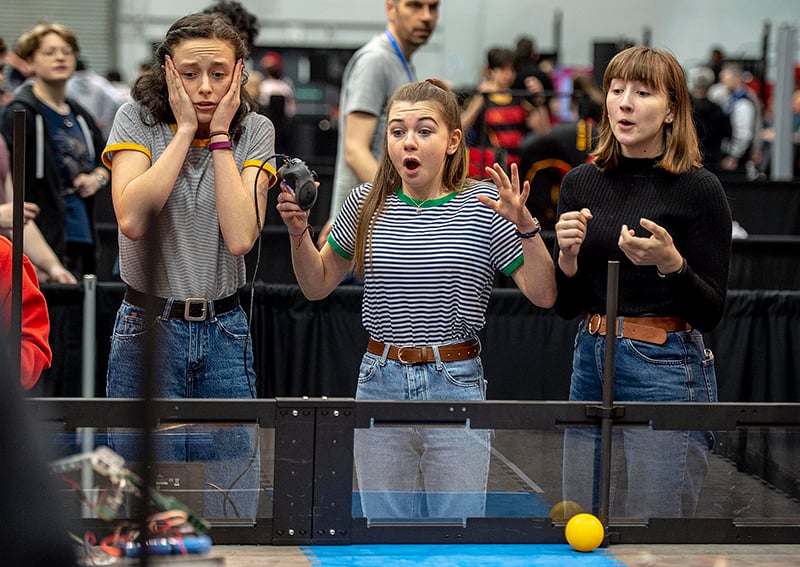 Students playing VEX game