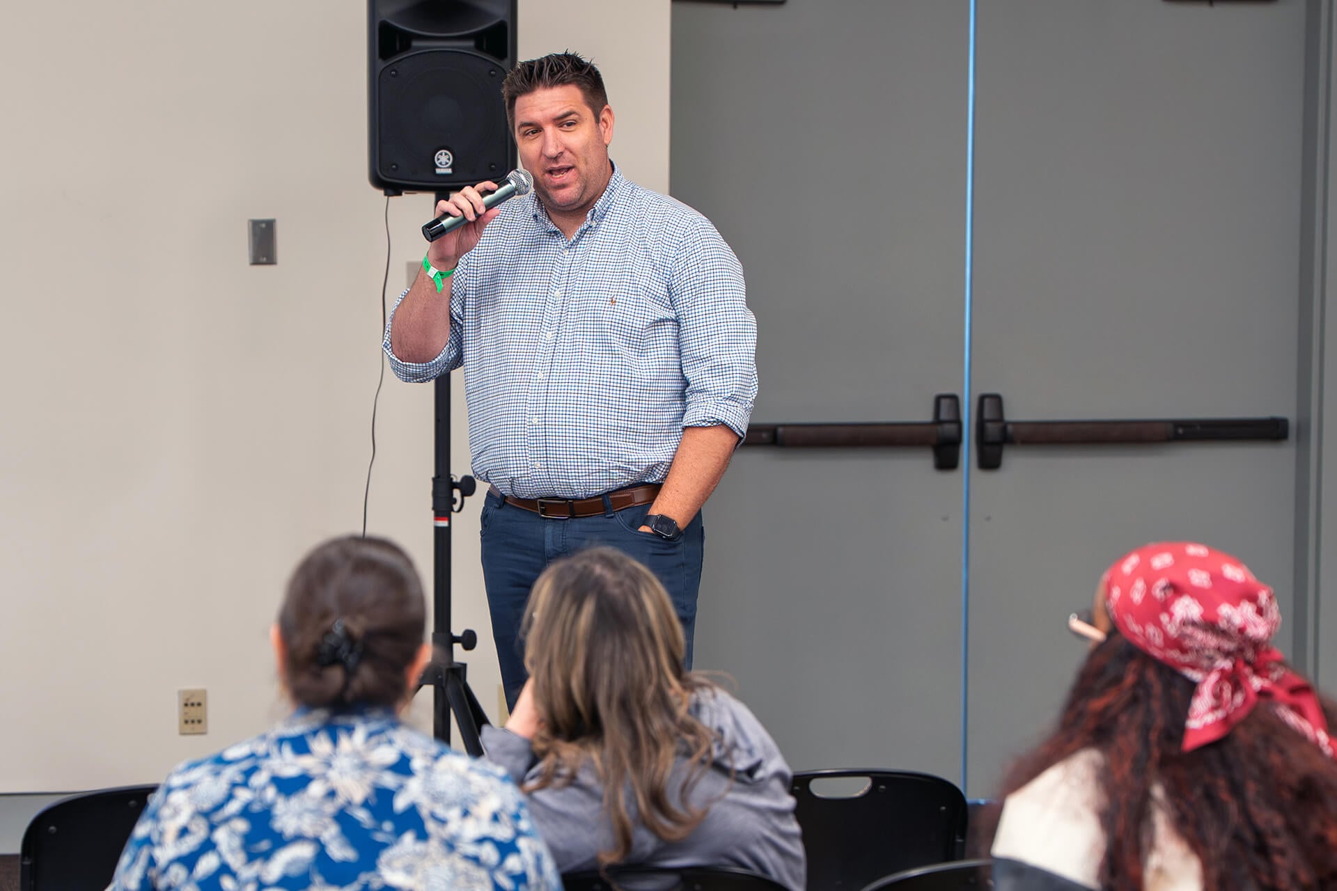 A speaker leading a VEX Robotics Educators Conference session.