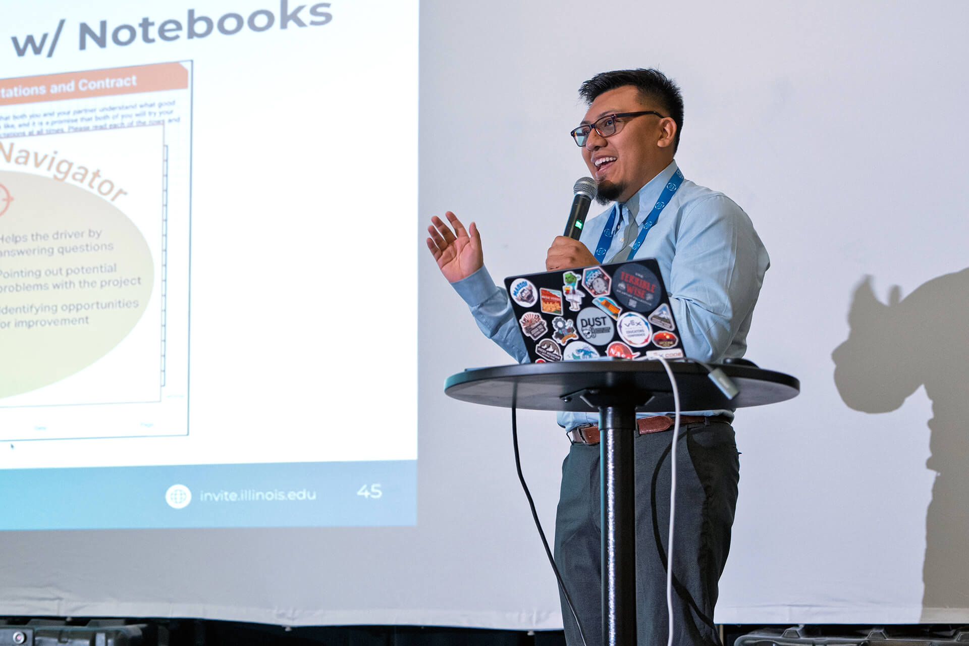 A presenter sharing resources with educators at the conference.