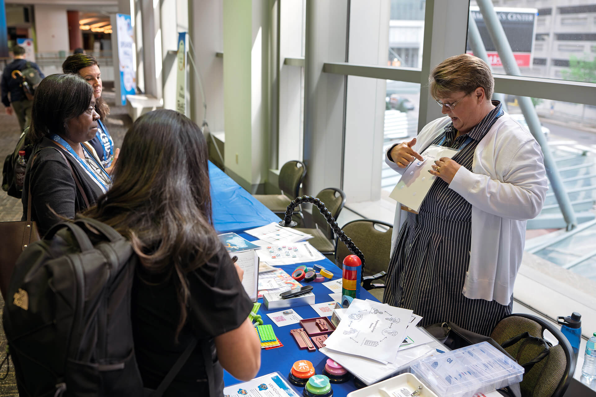 Educators testing robotics activities during a conference workshop.