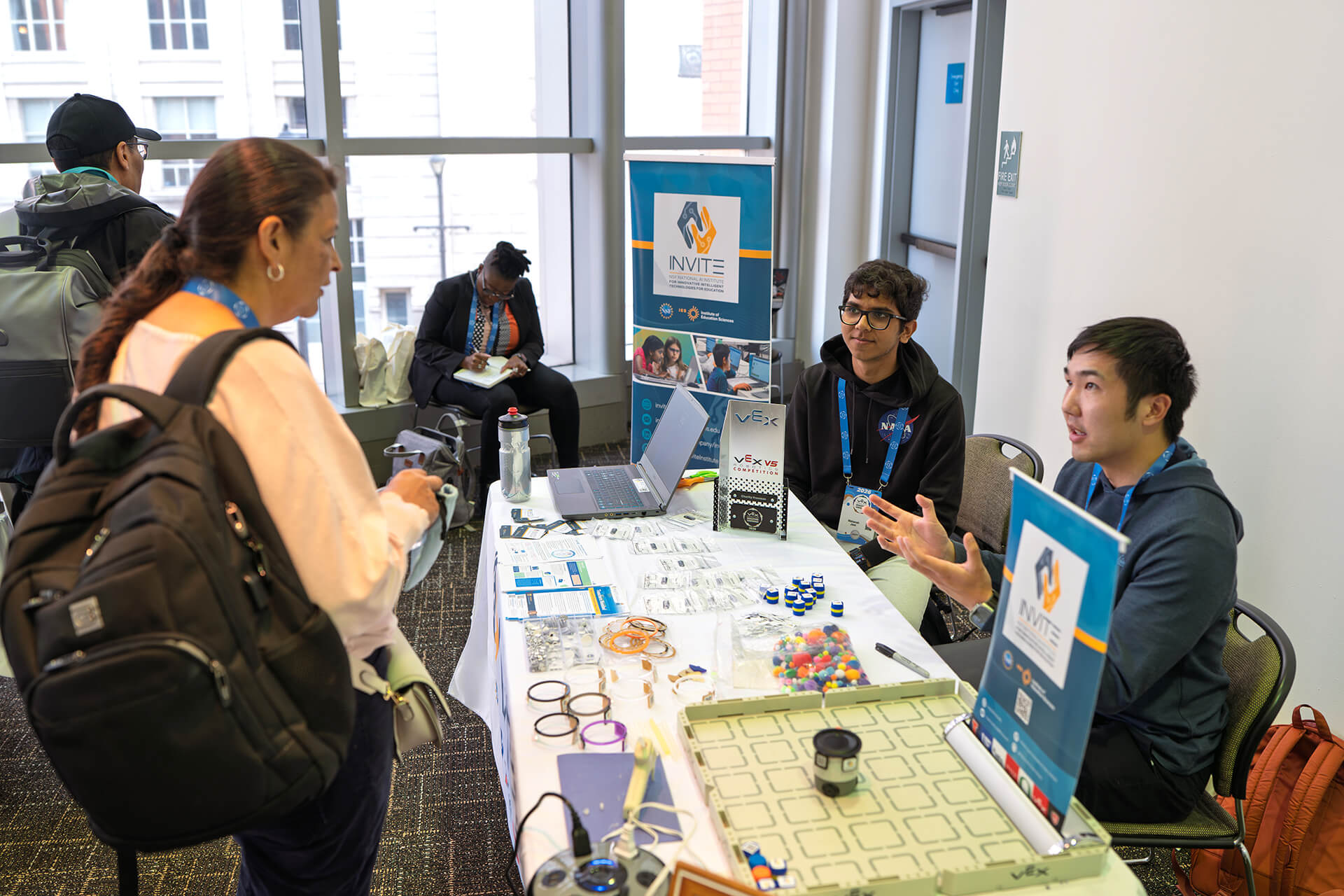 Educators gathered around a table for a hands-on workshop.